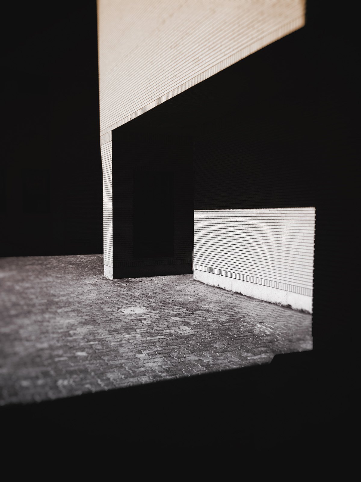 Minimalist street photography from the 'Urban Eclipse' series, featuring silhouettes and sharp geometric shadows against urban brick architecture.