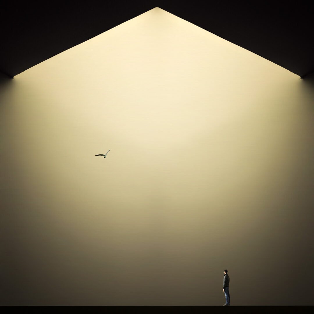 Minimalist fine art photography from the 'Comatose' collection, exploring consciousness through solitary silhouettes, stark shadows, and blinding geometric light.