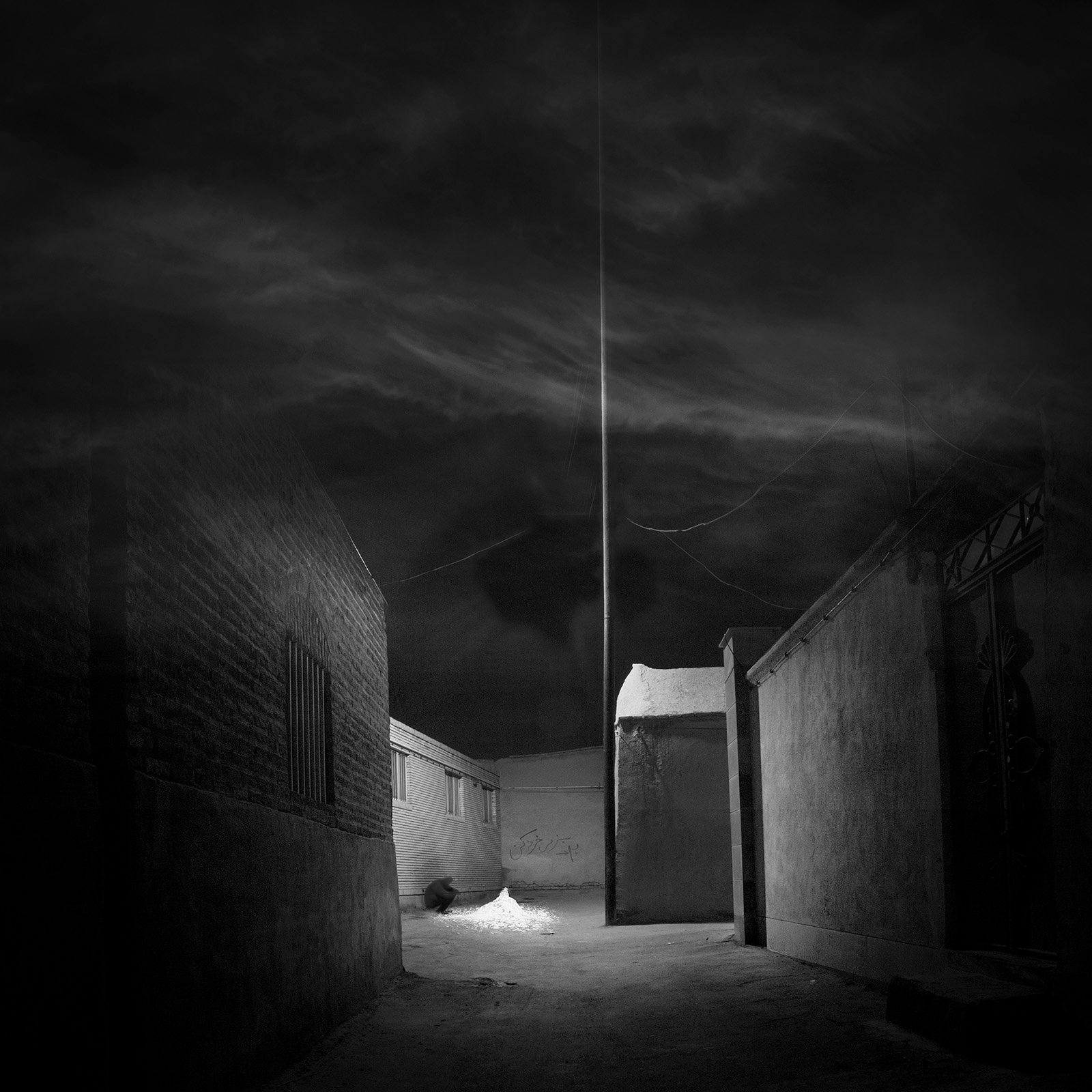 Conceptual photography from the 'Dark Side of the Mind' series, representing the 'dark energy' of the psyche through isolated subjects and infinite black voids.