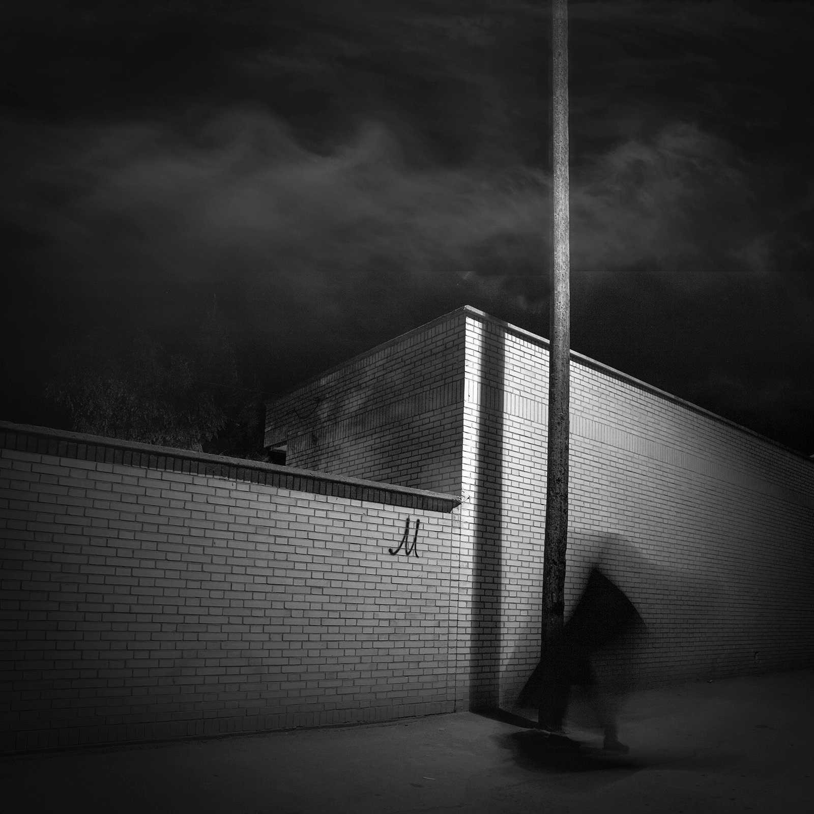 Conceptual photography from the 'Dark Side of the Mind' series, representing the 'dark energy' of the psyche through isolated subjects and infinite black voids.