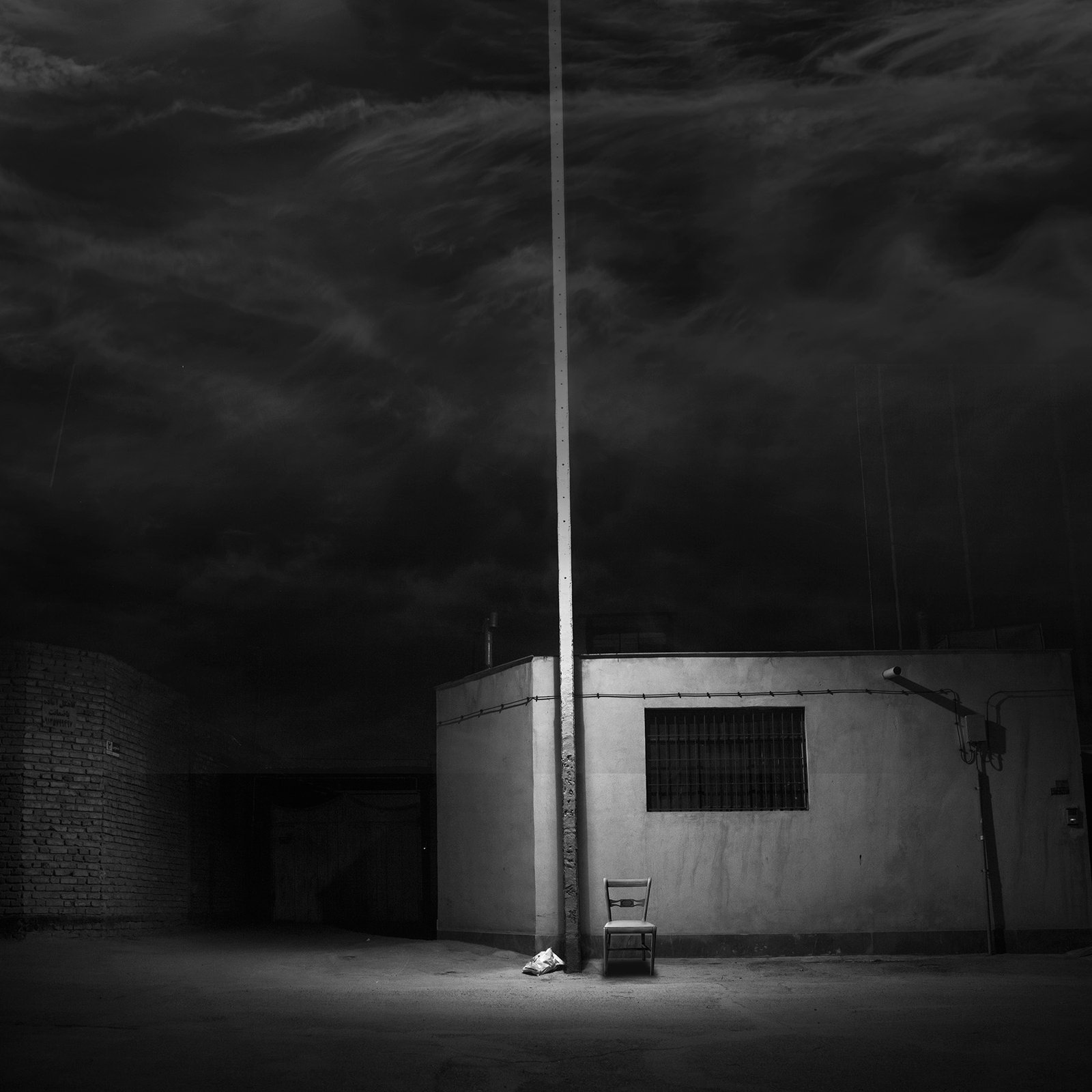 Conceptual photography from the 'Dark Side of the Mind' series, representing the 'dark energy' of the psyche through isolated subjects and infinite black voids.