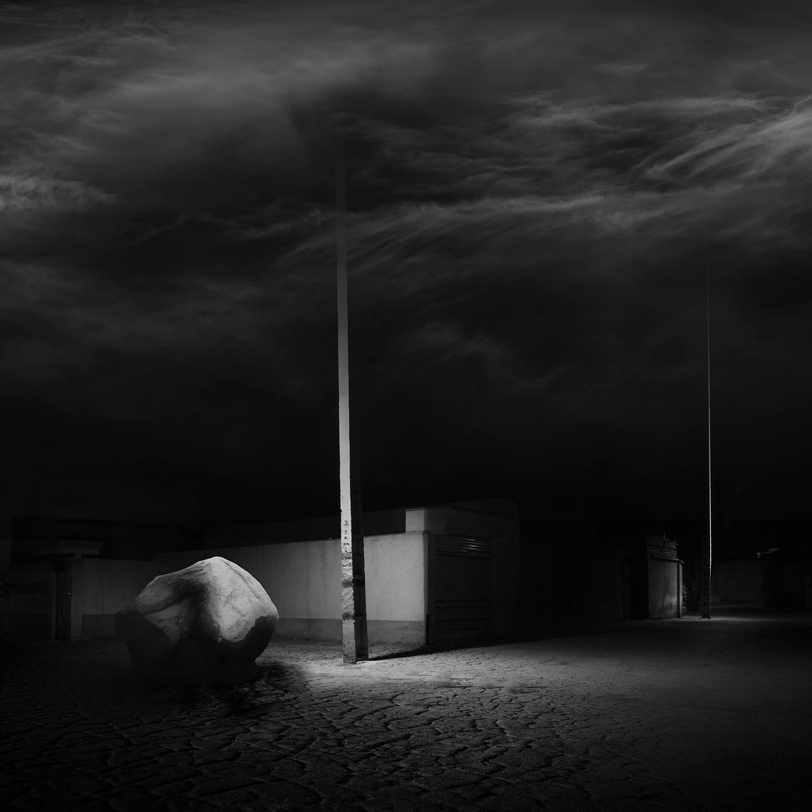 Conceptual photography from the 'Dark Side of the Mind' series, representing the 'dark energy' of the psyche through isolated subjects and infinite black voids.